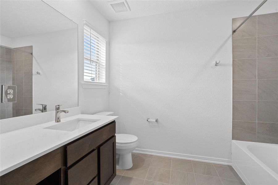 Furnished interior view inside a new home in Oakwood Trails, Tomball (Image 12).