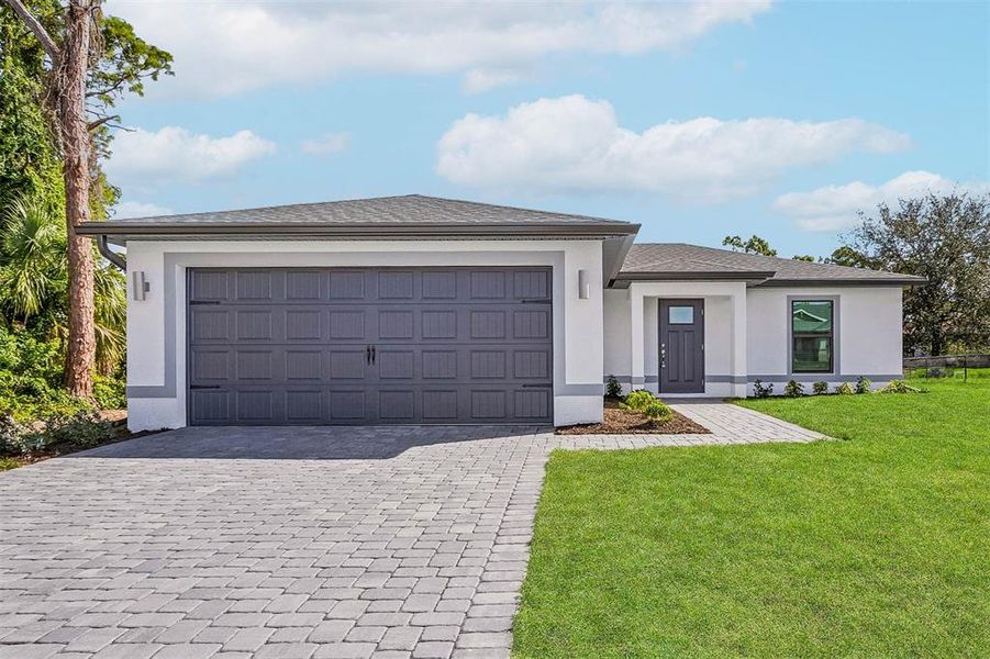 Front exterior of a new home in , Port Charlotte, FL, highlighting curb appeal (Image 1). Front exterior of a new home in , Port Charlotte, FL, highlighting curb appeal (Image 1).