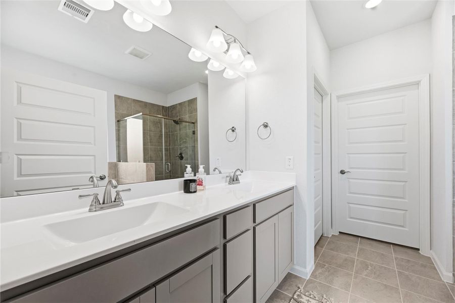 The primary bathroom is complete with a dual sink vanity, soaking tub, separate shower and walk-in closet. The primary bathroom is complete with a dual sink vanity, soaking tub, separate shower and walk-in closet.