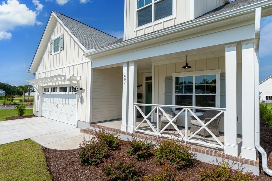 Front exterior of a new home in The Sanctuary at Sunset Beach, Sunset Beach, NC, highlighting curb appeal (Image 2).
