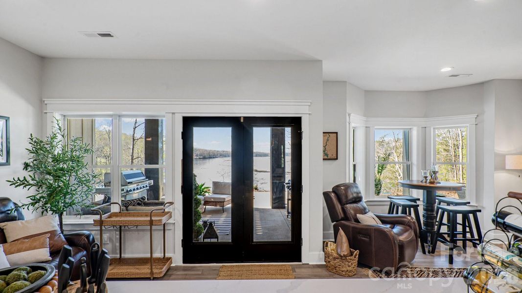 Basement Level Waterfront View To Outdoor Living Area
