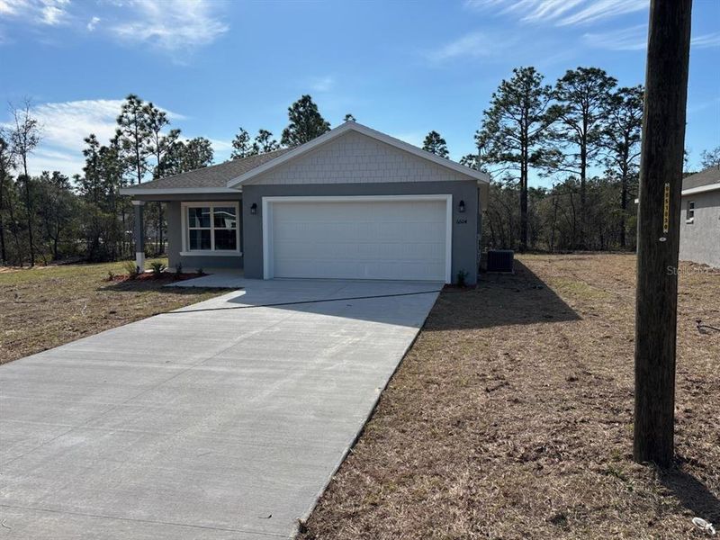 Front exterior of a new home in , Dunnellon, FL, highlighting curb appeal (Image 2). Front exterior of a new home in , Dunnellon, FL, highlighting curb appeal (Image 2).