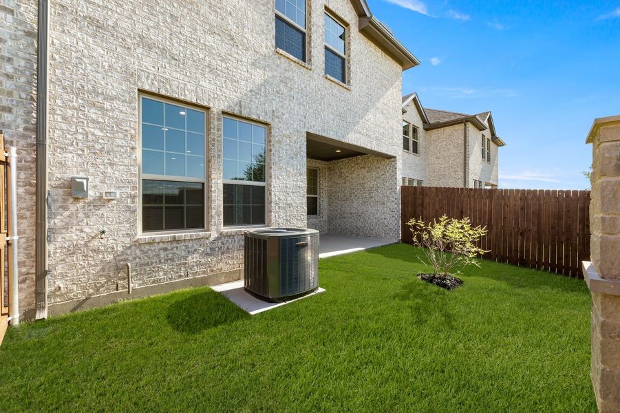 Front exterior of a new home in Main Street Village, Mansfield, TX, highlighting curb appeal (Image 27).