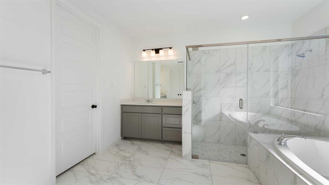 Bathroom with vanity and independent shower and bath