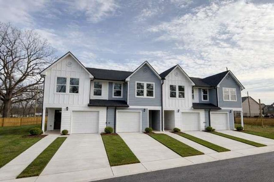 Front exterior of a new home in , Hampton, GA, highlighting curb appeal (Image 1). Front exterior of a new home in , Hampton, GA, highlighting curb appeal (Image 1).