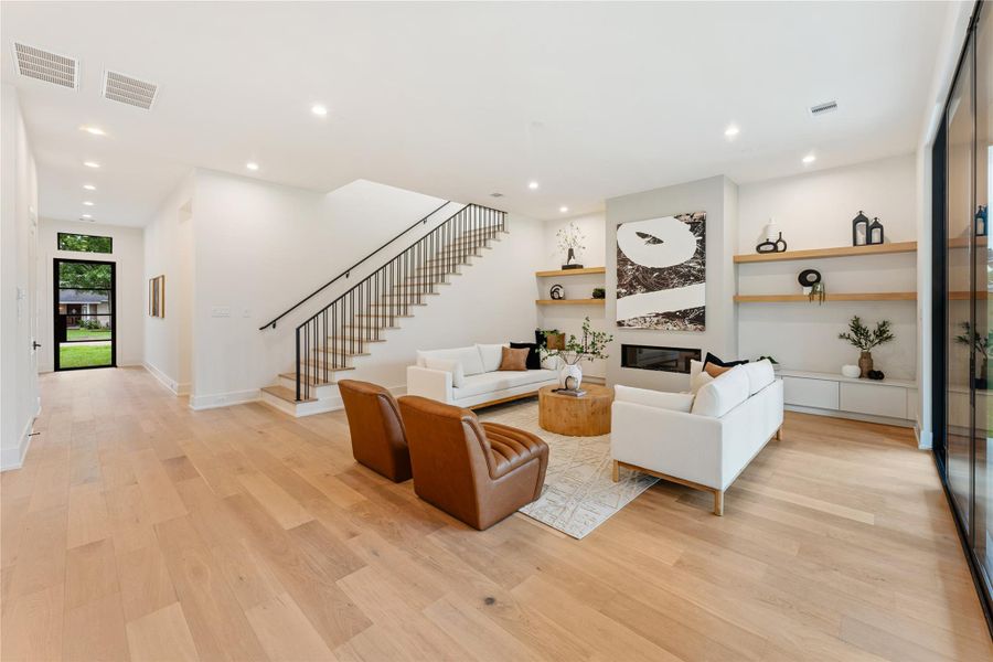The hallway foyer leads you to an impressive 25' x 19' great room providing the perfect backdrop for entertaining, with generous space for multiple seating areas and seamless flow throughout.