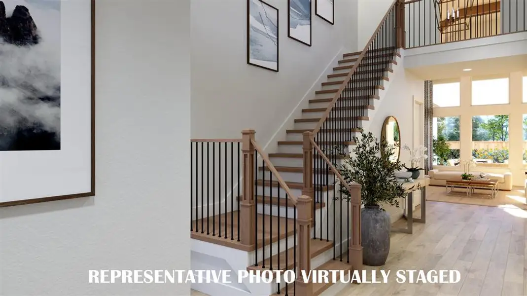 Step into our beautiful Ashland III dream home and be greeted by a gorgeous stair case featuring open railings and sight lines through to the rear of the home.  REPRESENTATIVE PHOTO VIRTUALLY STAGED