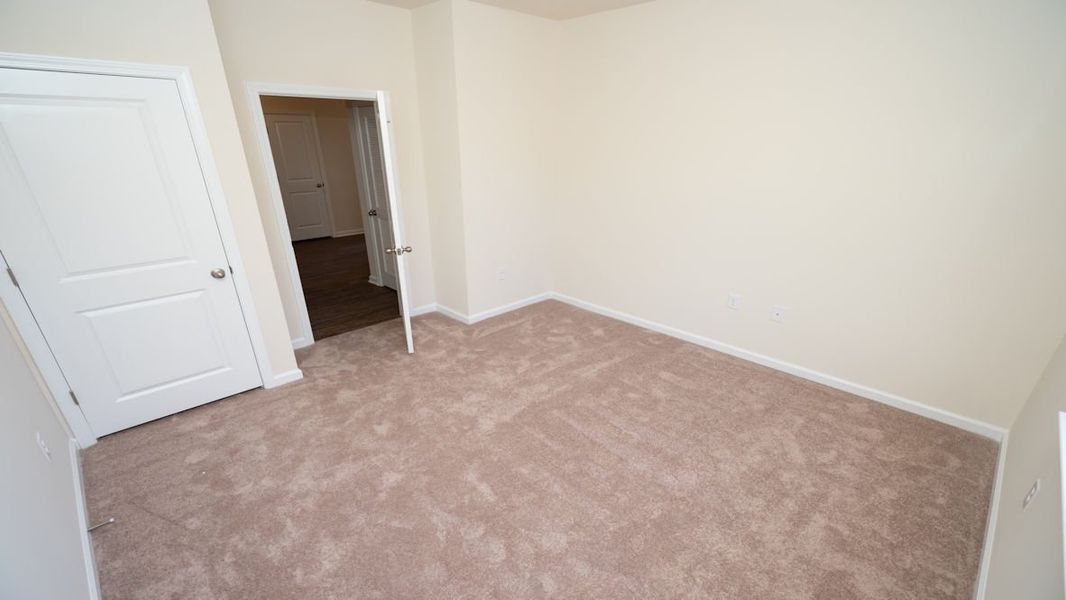 Representative unfurnished interior of a home built from the CALI by D.R. Horton in The Reserve at Wild Horse, Conway (Image 19).