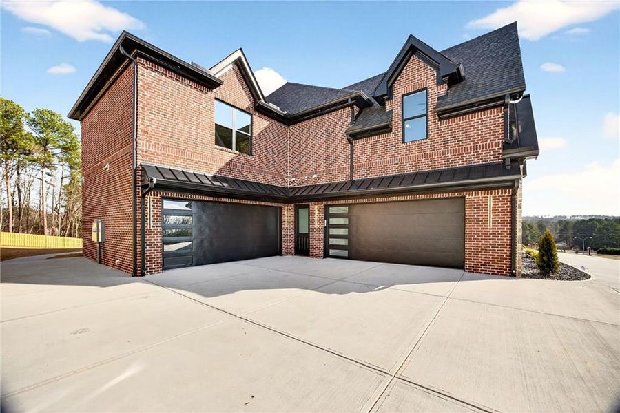 Front exterior of a new home in , Buford, GA, highlighting curb appeal (Image 1). Front exterior of a new home in , Buford, GA, highlighting curb appeal (Image 1).