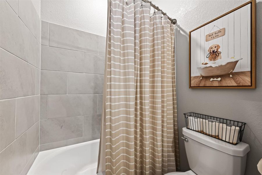 Secondary bath with tub and shower combination. Secondary bath with tub and shower combination.