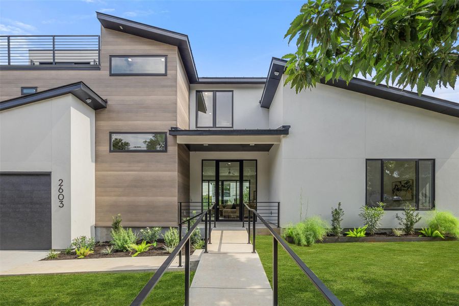 Front exterior of a new home in , Austin, TX, highlighting curb appeal (Image 1). Front exterior of a new home in , Austin, TX, highlighting curb appeal (Image 1).