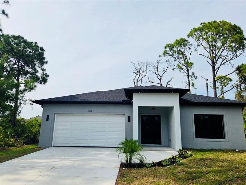 Front exterior of a new home in , Rotonda West, FL, highlighting curb appeal (Image 2). Front exterior of a new home in , Rotonda West, FL, highlighting curb appeal (Image 2).