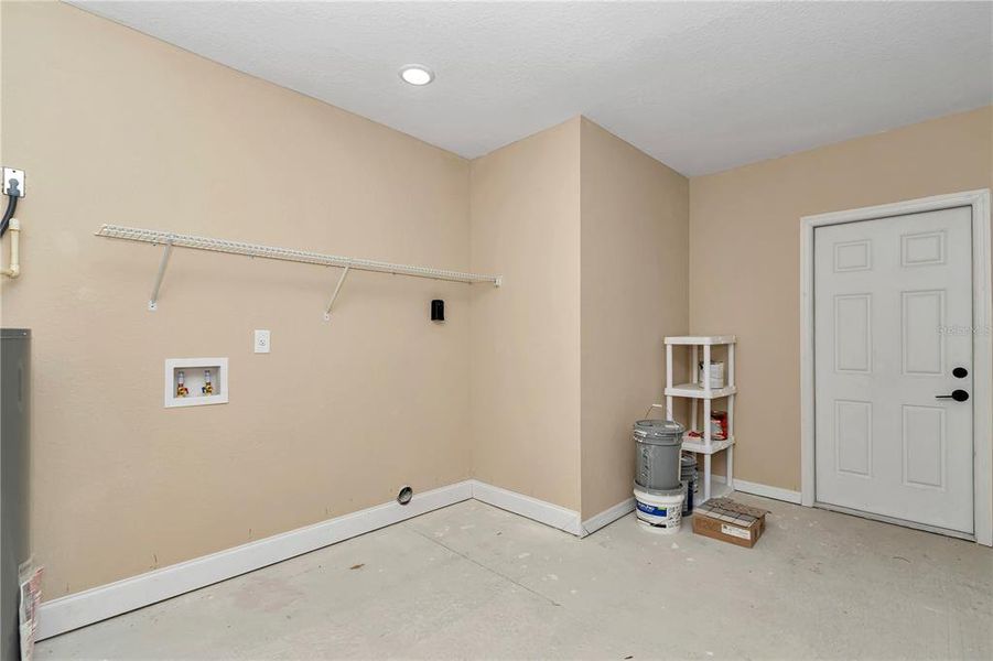 Laundry area w/access door to home