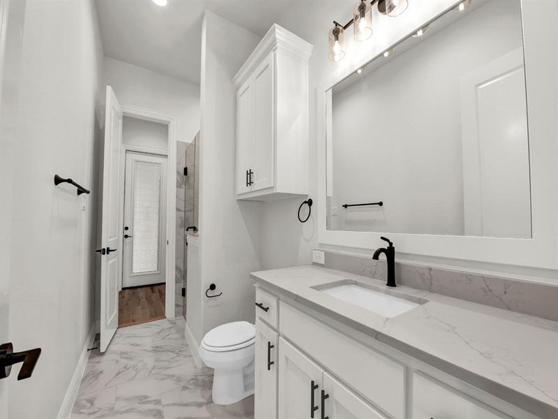 Bathroom with vanity and toilet