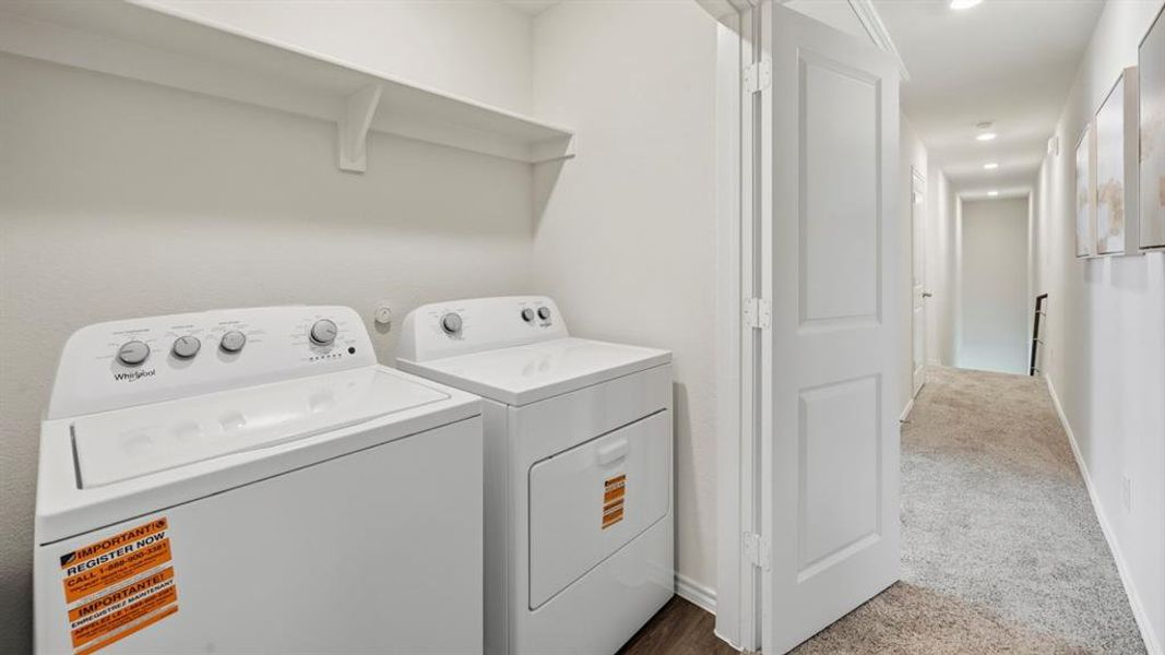 Laundry room featuring carpet floors, washer and dryer, and recessed lighting
