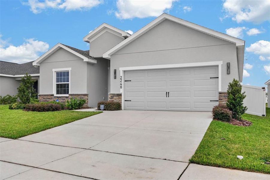 Front exterior of a new home in , Davenport, FL, highlighting curb appeal (Image 29).