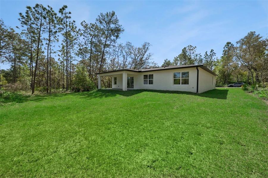 Exterior details and patio area of a home in , Citrus Springs (Image 24).