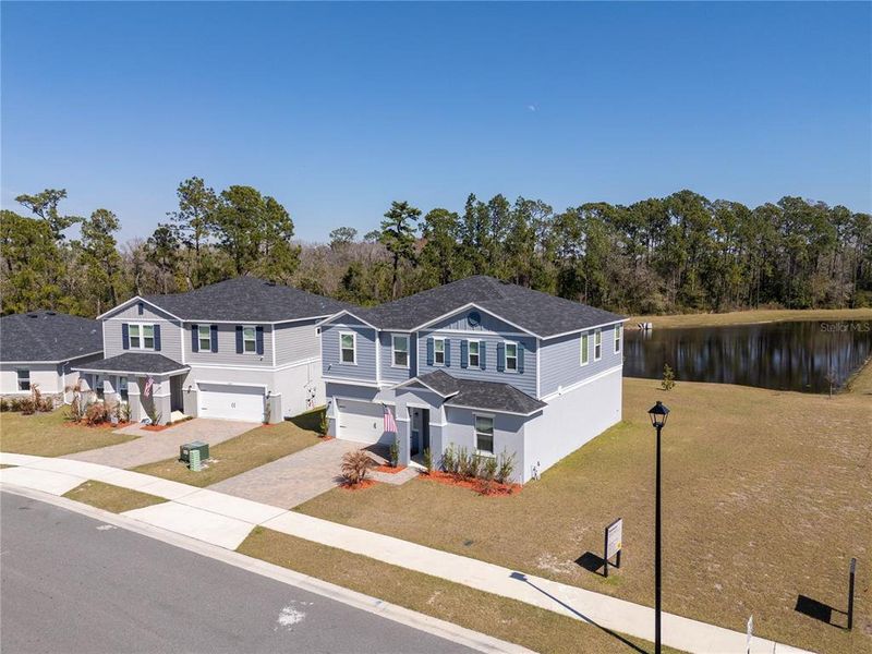 Front exterior of a new home in , Clermont, FL, highlighting curb appeal (Image 1). Front exterior of a new home in , Clermont, FL, highlighting curb appeal (Image 1).