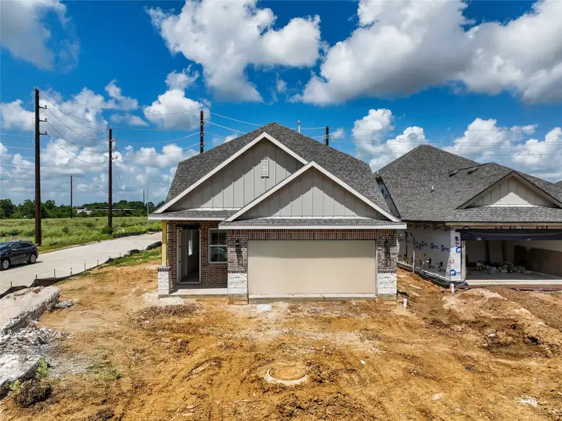 Front exterior of a new home in Oakberry Trails, Waller, TX, highlighting curb appeal (Image 1). Front exterior of a new home in Oakberry Trails, Waller, TX, highlighting curb appeal (Image 1).