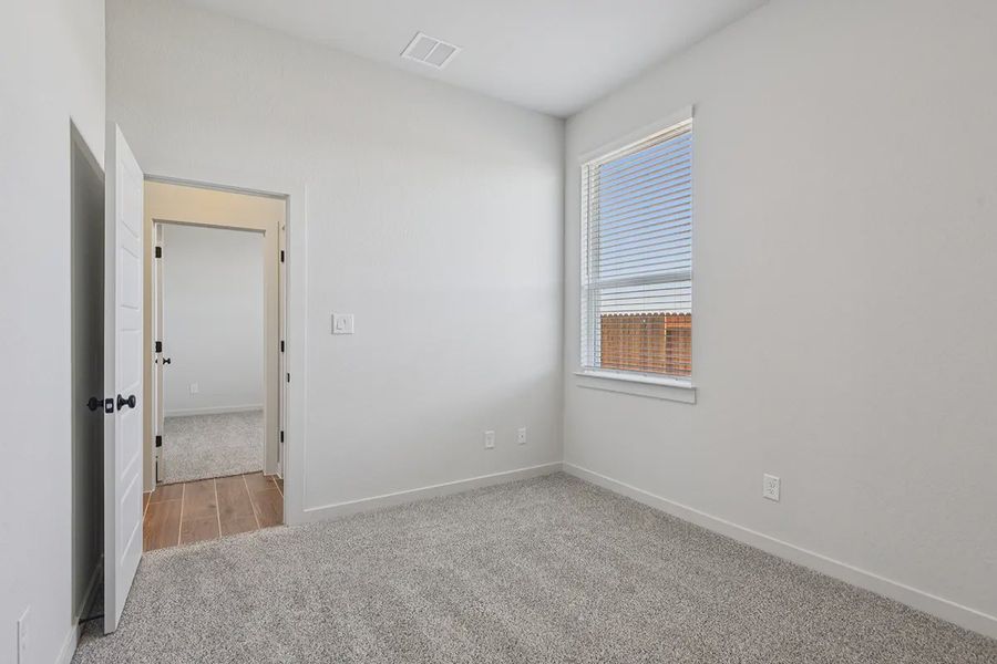 Representative unfurnished interior of a home built from the Rhyan by Chesmar Homes in Stream Waters, Seguin (Image 17).