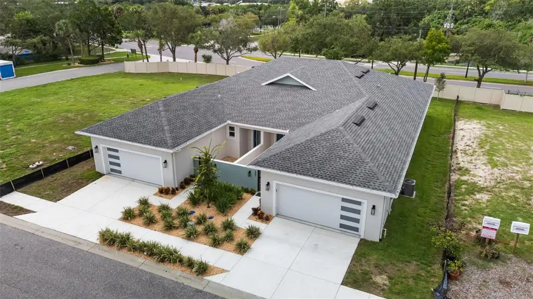 Front exterior of a new home in , Tarpon Springs, FL, highlighting curb appeal (Image 22).