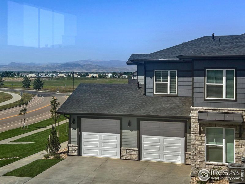 Front exterior of a new home in , Timnath, CO, highlighting curb appeal (Image 24).
