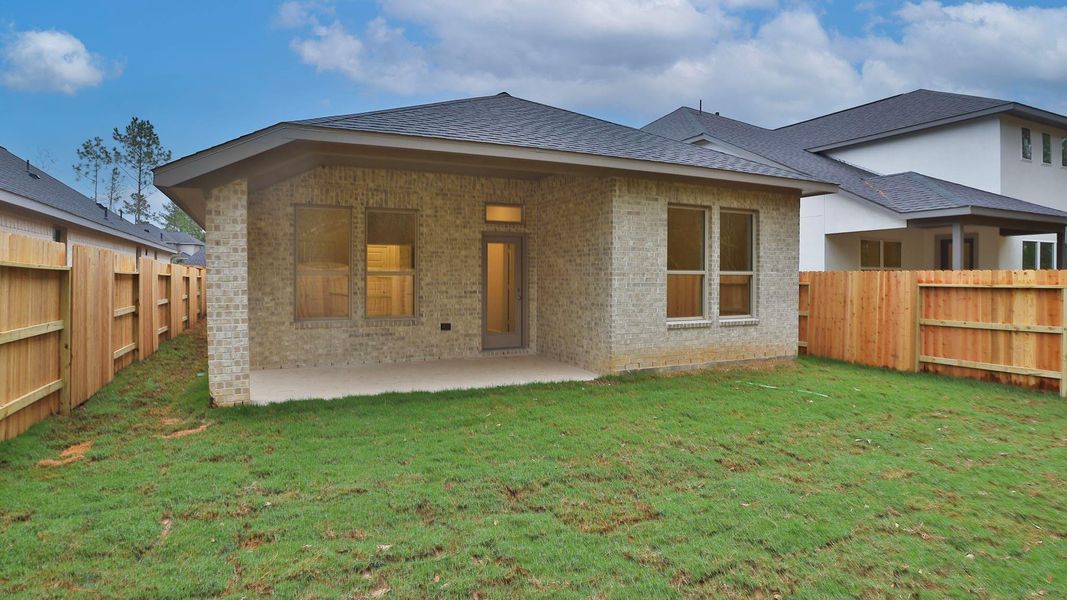 Exterior details and patio area of a home in Woodhavyn 40', Magnolia (Image 3). Exterior details and patio area of a home in Woodhavyn 40', Magnolia (Image 3).
