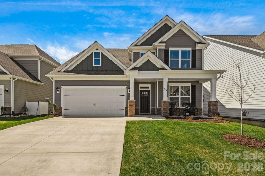 Front exterior of a new home in Cantrell Hills, Hendersonville, NC, highlighting curb appeal (Image 1). Front exterior of a new home in Cantrell Hills, Hendersonville, NC, highlighting curb appeal (Image 1).