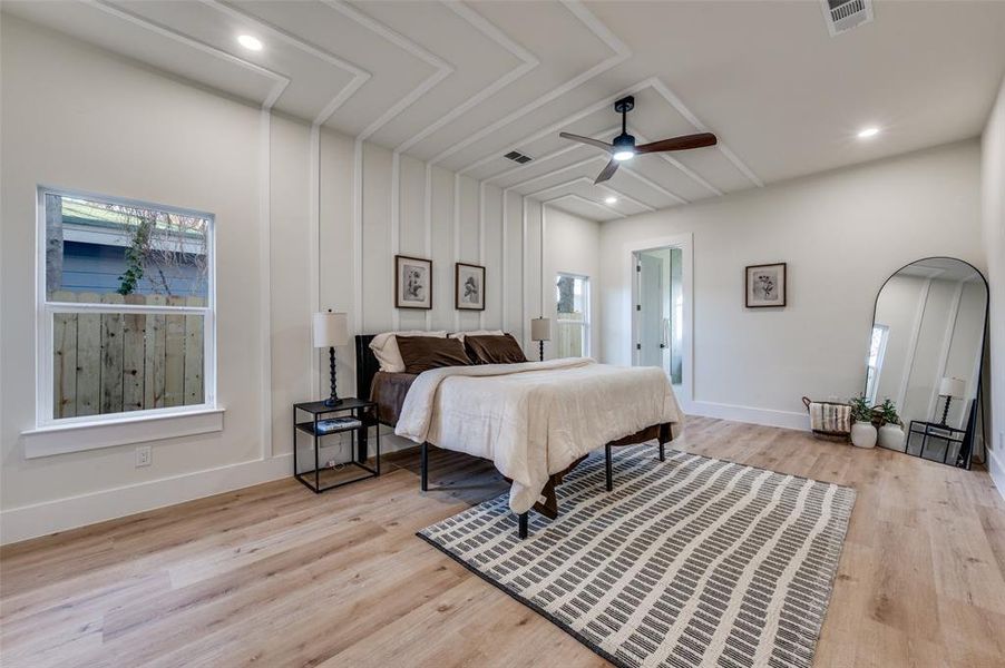 Bedroom featuring a ceiling fan, light wood-style floors, and recessed lighting