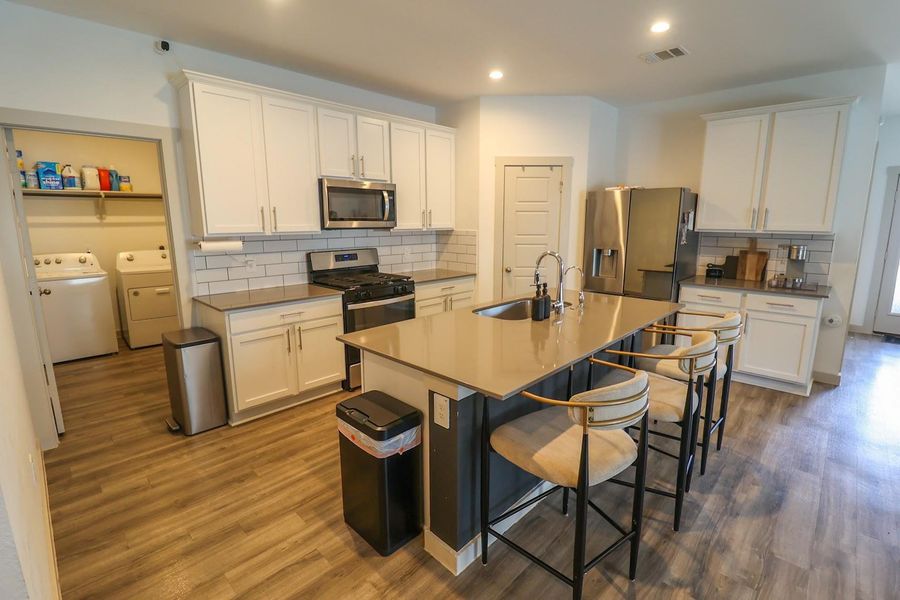 Open floor plan with the kitchen area opening to the family room. W&D conveniently located near kitchen. Open floor plan with the kitchen area opening to the family room. W&D conveniently located near kitchen.