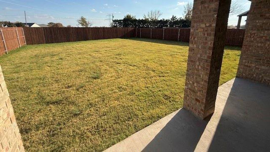 Exterior details and patio area of a home in Fireside by the Lake, Garland (Image 4).