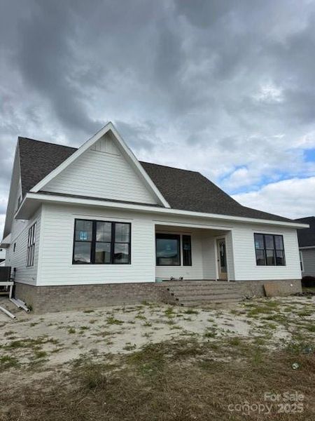 Front exterior of a new home in , Morehead City, NC, highlighting curb appeal (Image 7).