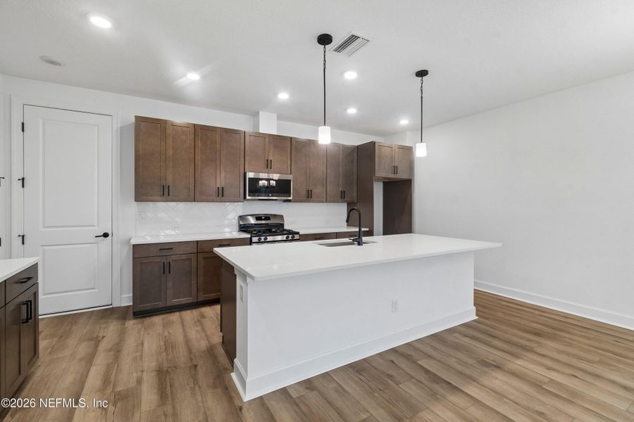 Furnished interior view inside a new home in Westerly Park at Wildlight - Courtyard Collection, Yulee (Image 15).