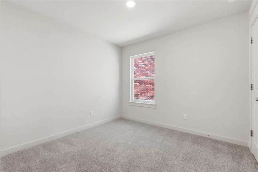 Unfurnished room with light carpet and recessed lighting