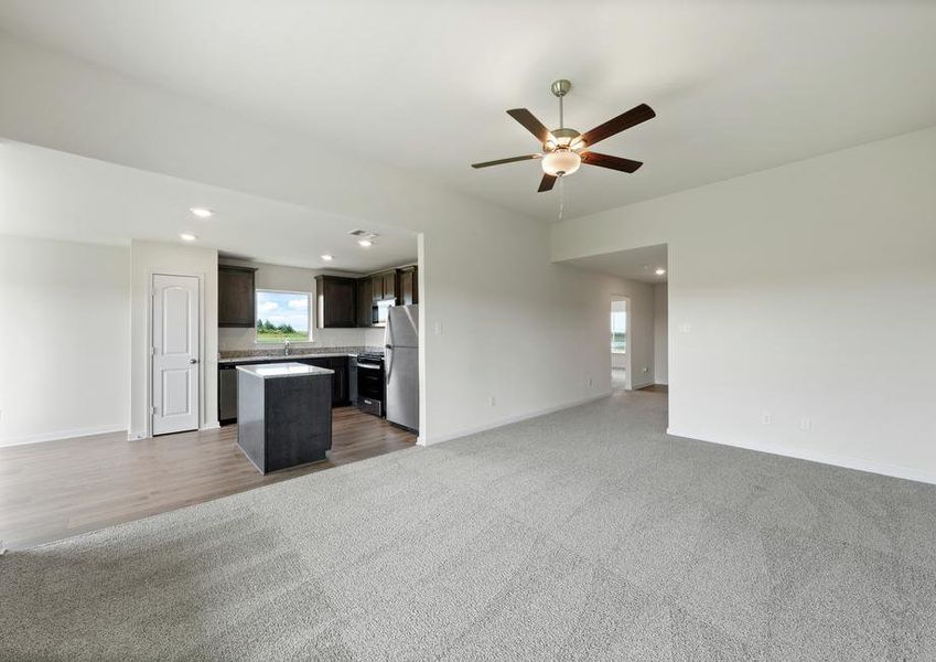 The open layout connects the family room with the kitchen and dining room.