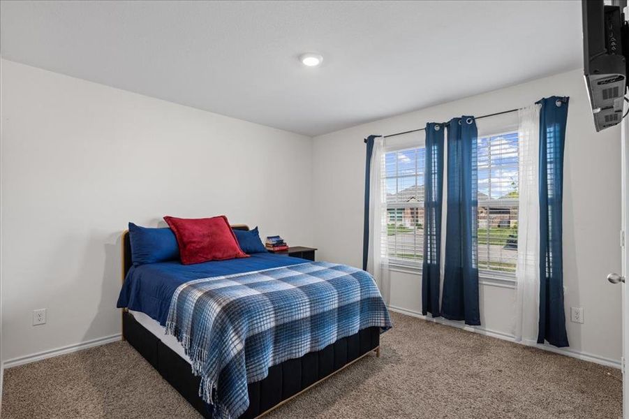 Bedroom featuring carpet Bedroom featuring carpet