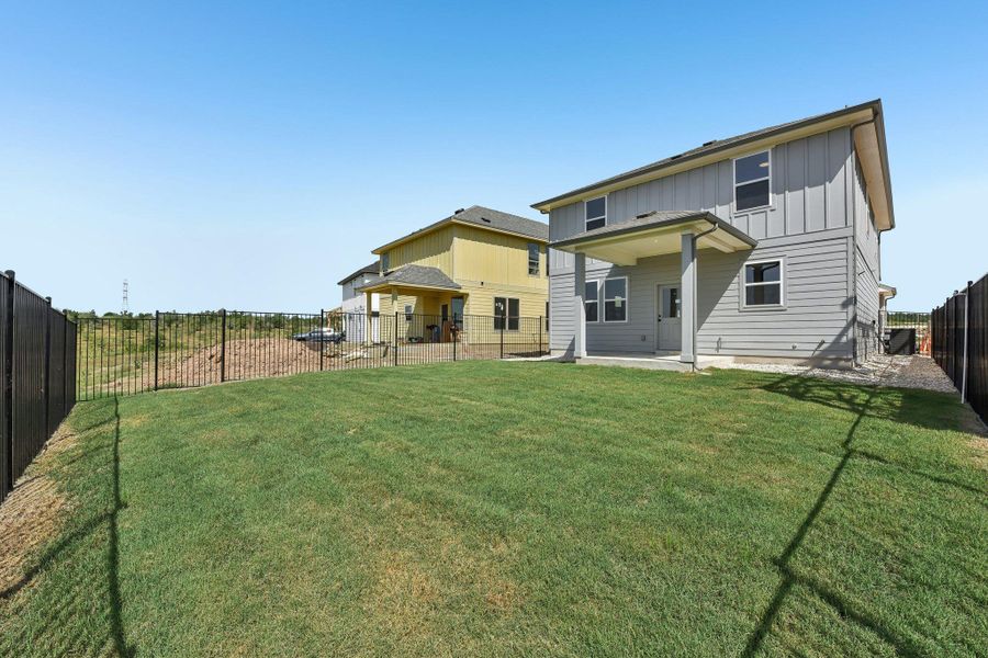 Exterior details and patio area of a home in Saddle Ridge at Wildhorse Ranch, Austin (Image 3).