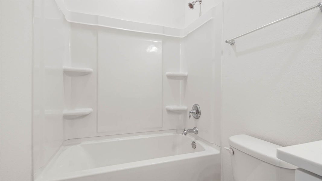 Representative furnished interior of a home built from the Kennedy by D.R. Horton in Bayside at Ward Creek, Panama City Beach (Image 24).