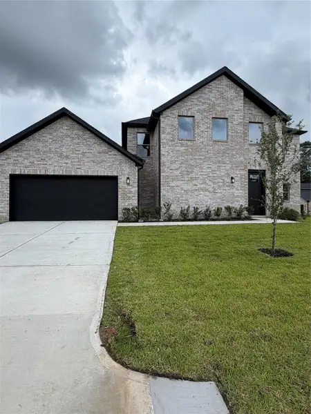 Front exterior of a new home in , Spring, TX, highlighting curb appeal (Image 17).