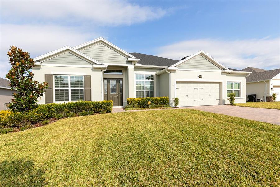 Front exterior of a new home in Wolf Lake Ranch, Apopka, FL, highlighting curb appeal (Image 25).
