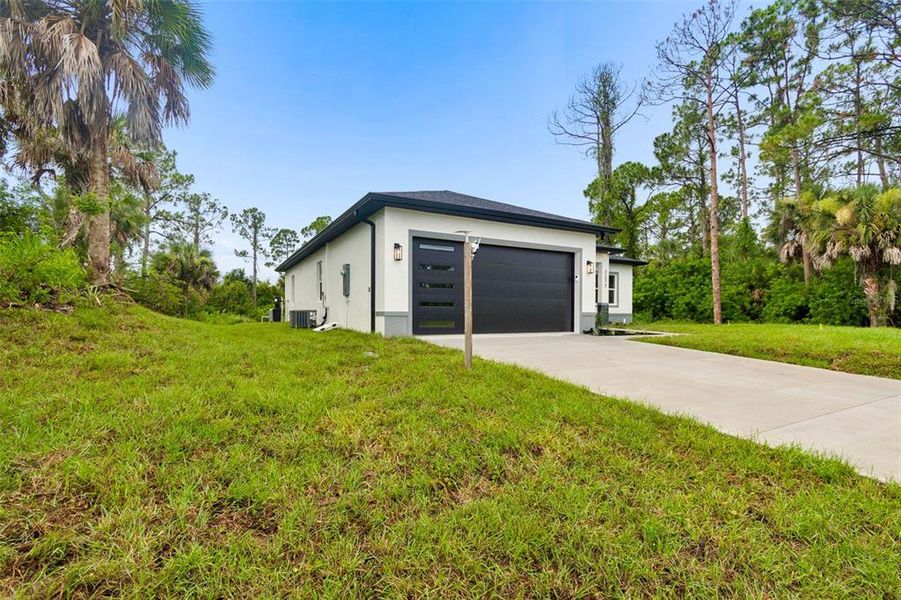 Front exterior of a new home in , North Port, FL, highlighting curb appeal (Image 32). Front exterior of a new home in , North Port, FL, highlighting curb appeal (Image 32).