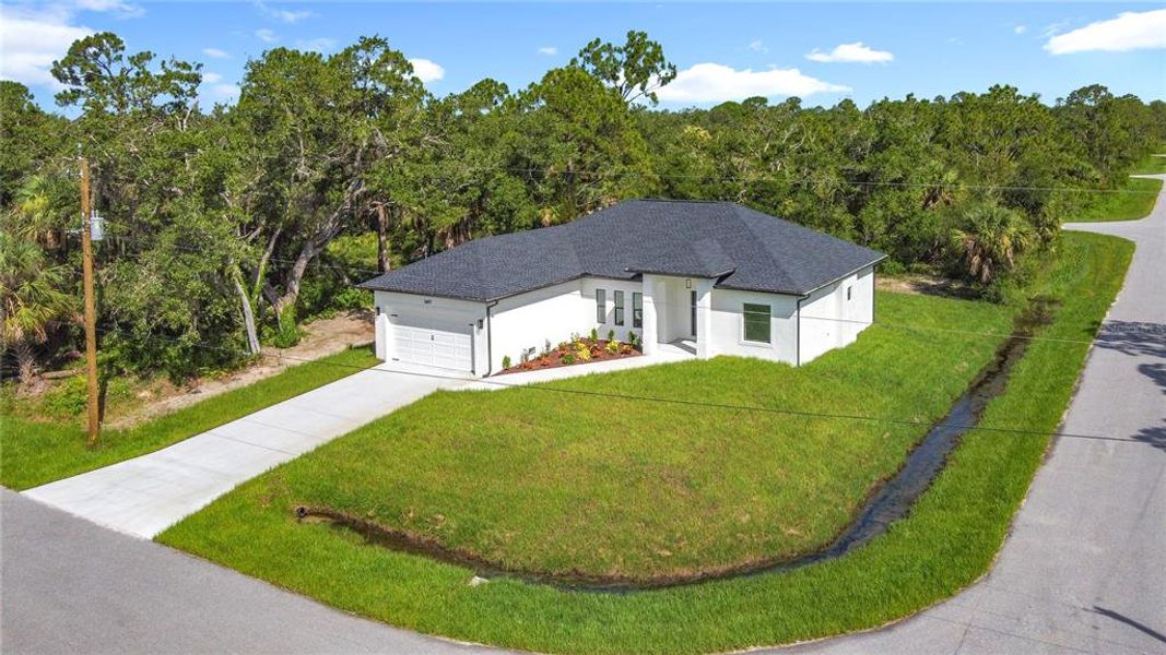 Front exterior of a new home in , Englewood, FL, highlighting curb appeal (Image 21).