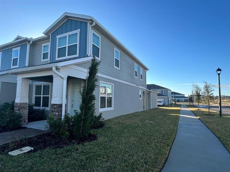 Front exterior of a new home in , Winter Garden, FL, highlighting curb appeal (Image 19).