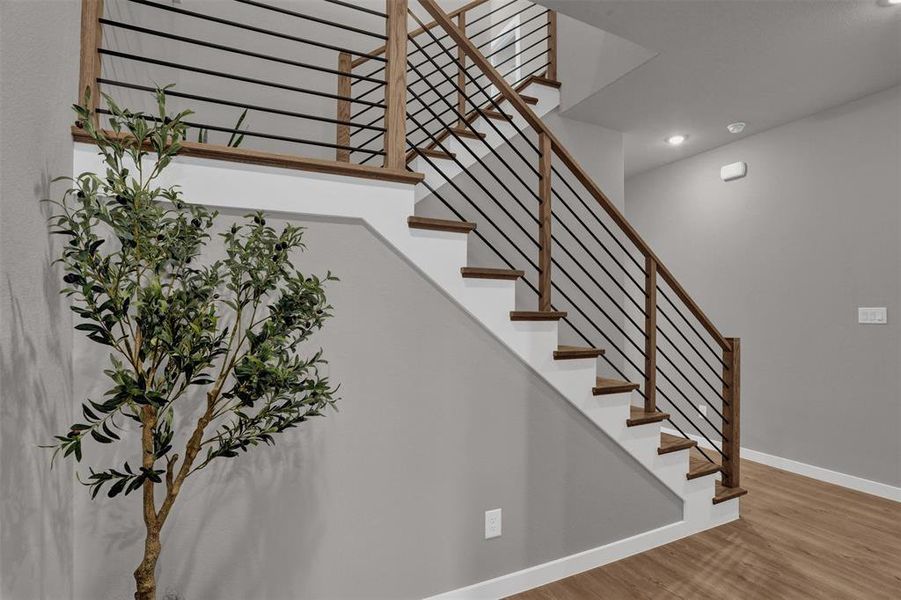 The sleek, open staircase becomes an architectural focal point, blending modern lines with natural materials to elevate the home’s contemporary feel. The sleek, open staircase becomes an architectural focal point, blending modern lines with natural materials to elevate the home’s contemporary feel.