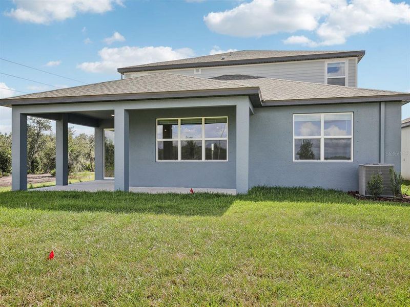 Exterior details and patio area of a home in Coasterra - Reserve Series, Palmetto (Image 26).