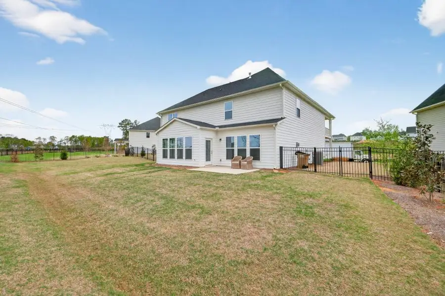 Exterior details and patio area of a home in Reunion, Flowery Branch (Image 4).
