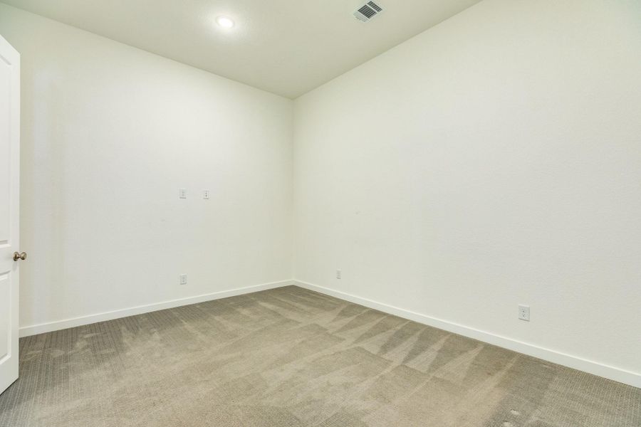Media room featuring custom media setup with integrated electrical and cable outlets for seamless TV or home theater installation.