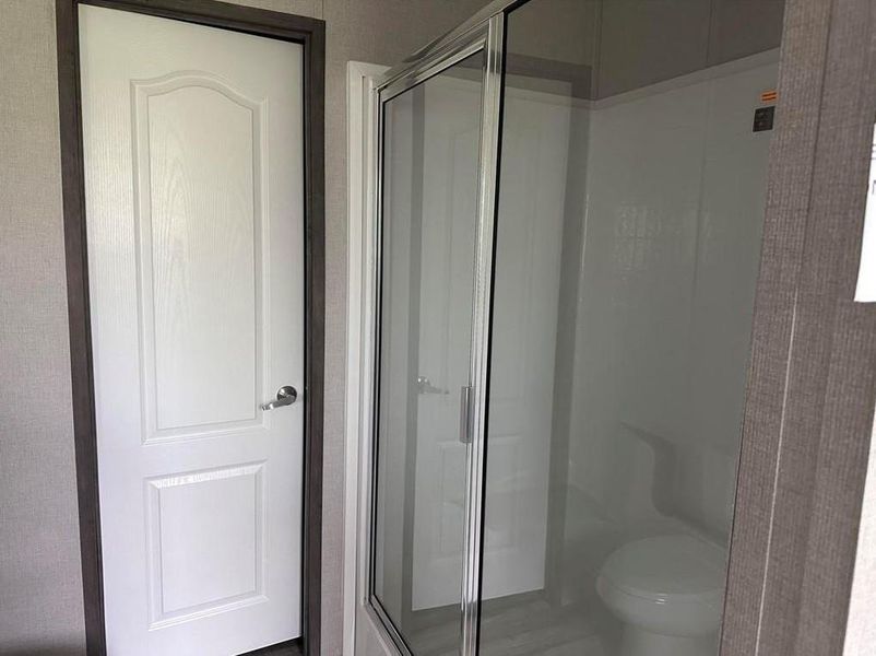 Bathroom featuring a stall shower Bathroom featuring a stall shower