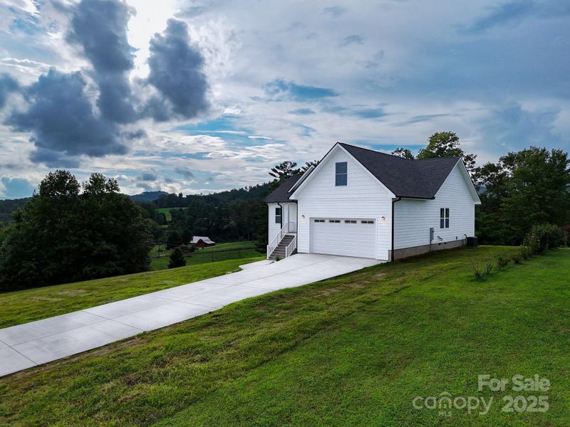 Front exterior of a new home in , Hendersonville, NC, highlighting curb appeal (Image 27). Front exterior of a new home in , Hendersonville, NC, highlighting curb appeal (Image 27).