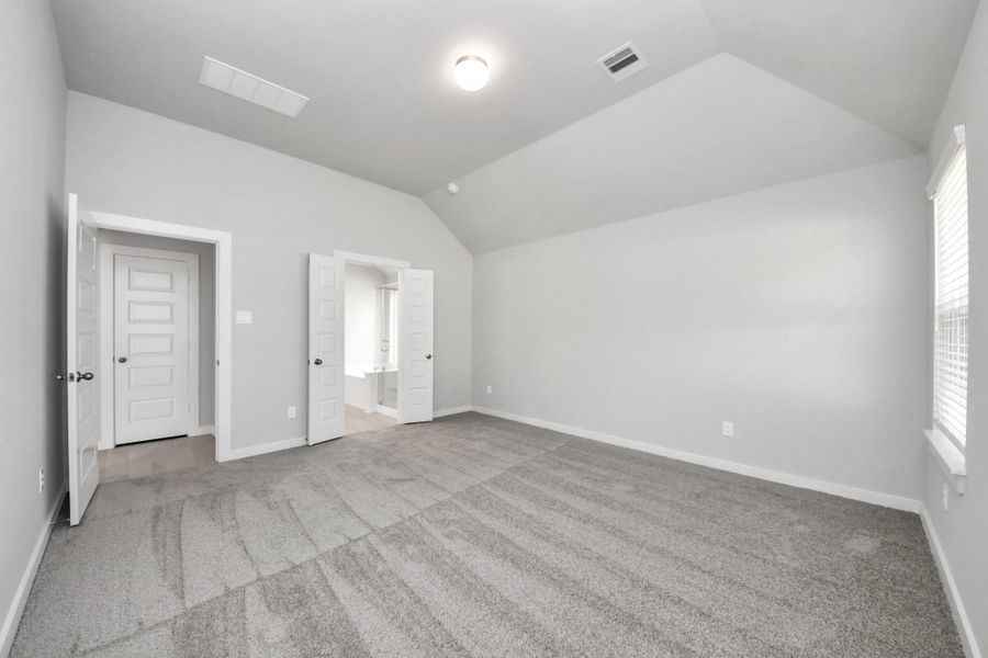 Come and unwind after a long day in this magnificent primary suite! This spacious room features plush carpet, warm paint, high ceilings and large windows with privacy blinds. Sample photo of completed home with similar floor plan. Actual colors and selections may vary. Come and unwind after a long day in this magnificent primary suite! This spacious room features plush carpet, warm paint, high ceilings and large windows with privacy blinds. Sample photo of completed home with similar floor plan. Actual colors and selections may vary.